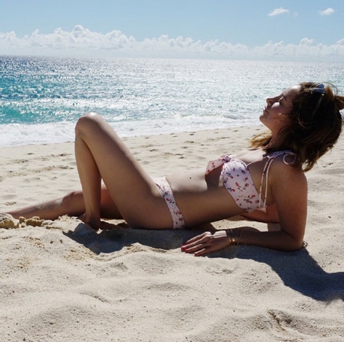 Instagram photo of Ashley Tisdale posing on a beach
