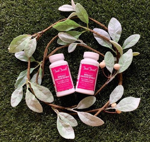 two bottles of breast enhancement supplements