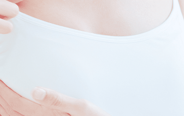 woman massaging breast