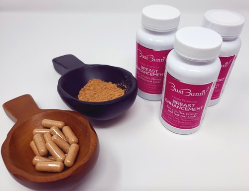 bottles and capsules of breast enhancement supplements