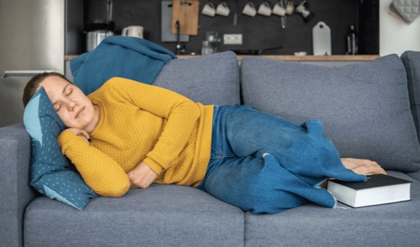 woman sleeping on a couch