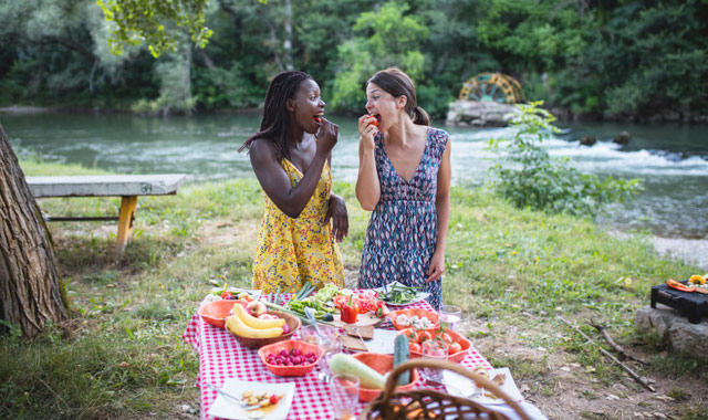 cheerful women eating healthy foods