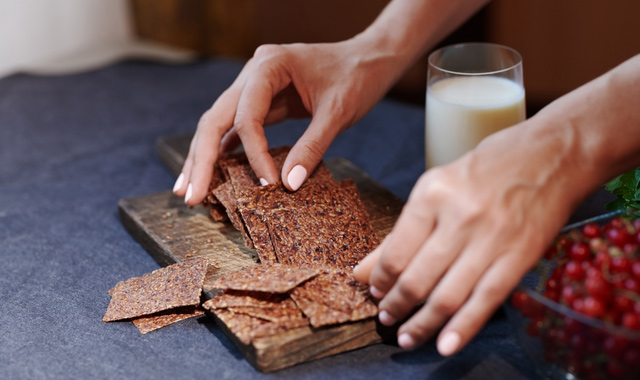 woman serving flaxseed bread