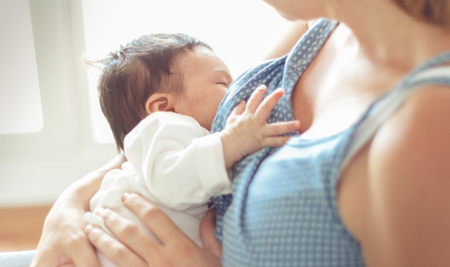 woman breastfeeding her baby