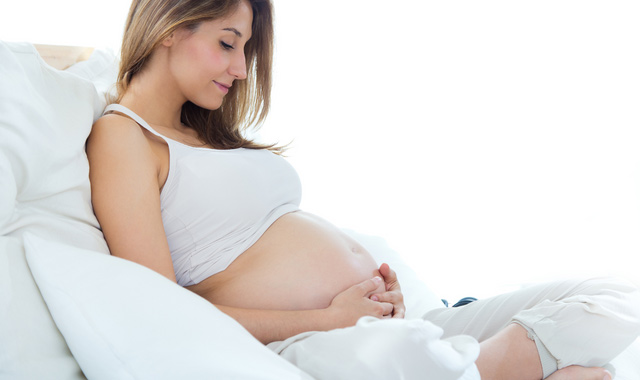 pregnant woman relaxing at home
