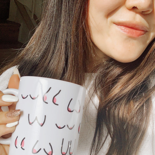 lady holding a cup with boob imprints