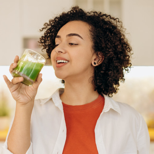 woman drinking a fresh smoothie