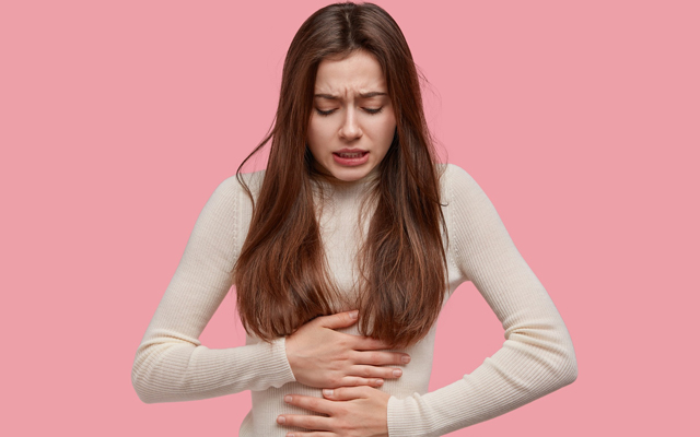 woman holding stomach